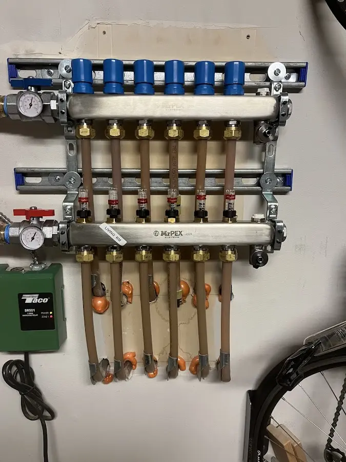 Plumber performing Water Heater Repair at a residential property in Loveland